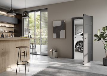 Hochwertige und moderne Garagentüren von Ringo bei Gschwander in Heddesheim Ein Blick in einen Wohnraum, der durch eine Garagentür mit der Garage verbunden ist